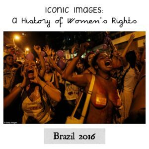 The image shows women marching, protesting, and raising slogans.